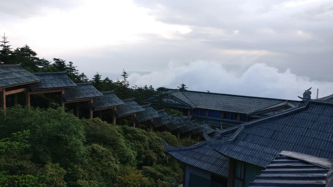 Temple rooftops above a sea of clouds on Mount Emei