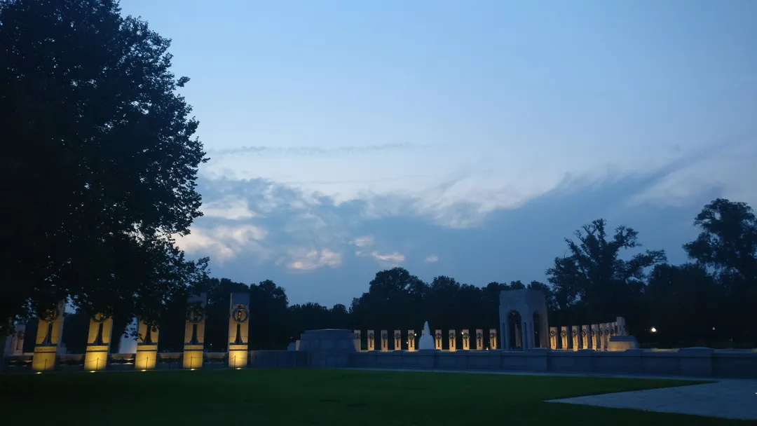 The World War II Memorial glowing at dusk