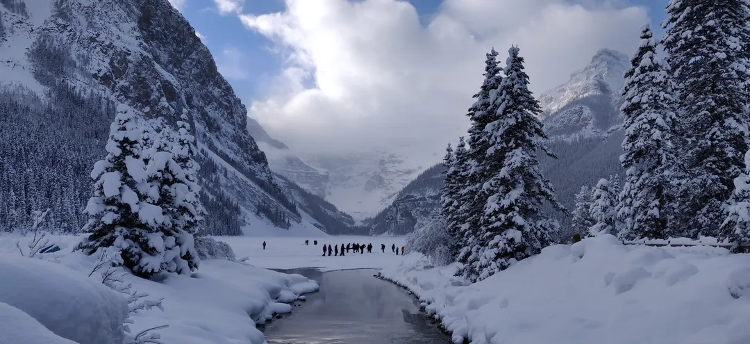 Skaters far out on frozen Lake Louise