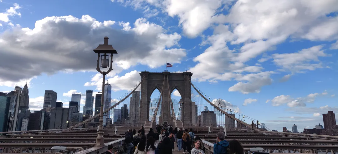 On the Brooklyn Bridge promenade, Manhattan behind